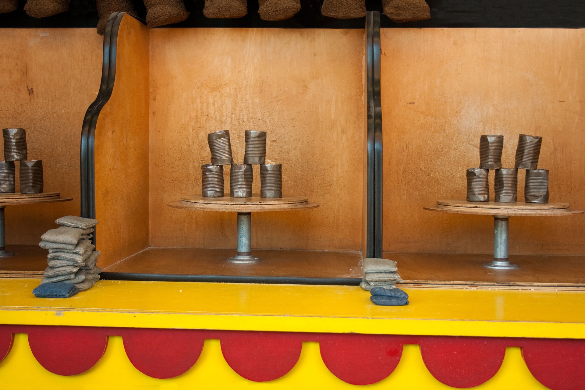 A boardwalk and carnival can game that is set up